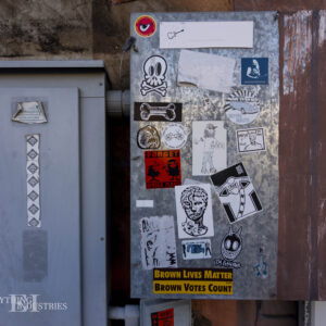 The circuit and power boxes at Maria's Taco Express with various stickers on it