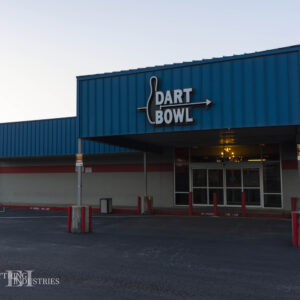 The front doors of Dart Bowl, with the large Dart Bowl sign on the front fascia