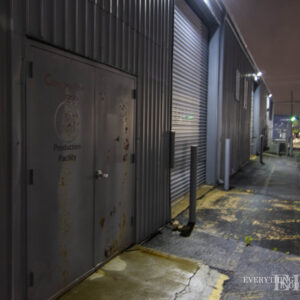 The side roll-up doors of Musiclab on a foggy night
